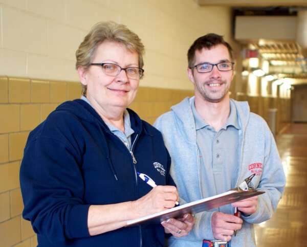 Walter and woman smiling at camera