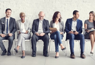 men and women sitting and laughing