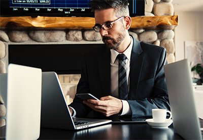 man in a suit at his laptop