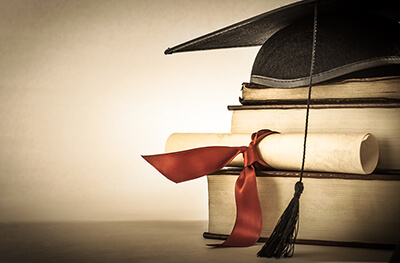 graduation cap and certificate