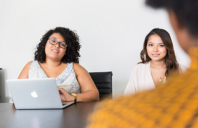 Women at meeting table