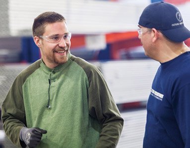 Photo of Josh at work with a colleague